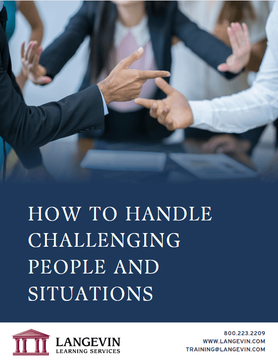 Businesspeople in a meeting room gesturing and having a discussion on handling challenging people and situations
