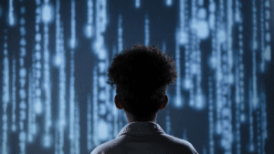 Rear view of person with curly hair looking at digital screen displaying lines of computer code