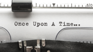 Close-up of typewriter printing 'Once Upon A Time' phrase, symbolizing storytelling and writing