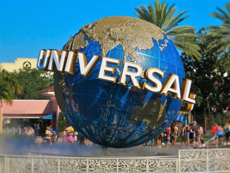 Famous Universal Studios globe landmark in Orlando with tourists in the background